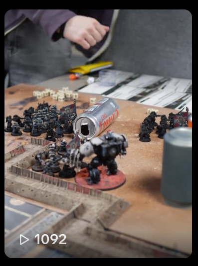 A screenshot of a TikTok video which features a still close up shot of Warhammer being played. The video has 1092 views at the time in which the screenshot is taken.